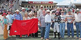 The winning connections of Jess A Dash Of Class accept the KC Carden Wyoming Bred Derby stakes trophy at Wyoming Downs Saturday.