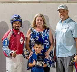 The winning connections of Power Of The Smile accept the Virgil Bond Stakes trophy at Delta Downs Saturday night.