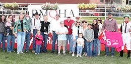 The winning connections of Rona Rowsey accept the Cherry Creek Futurity stakes trophy on Sunday