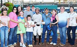 The winning connections of Cuz Eyema Cowboy Baby accept the Speedhorse Paint and Appaloosa Futurity stakes trophy at Fair Meadows Saturday.