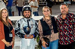 The winning connections of Gotagogh accept the Firecracker Derby stakes trophy.