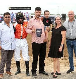The winning connections of Cv Denali accept the Gordon Mobley Futurity stakes trophy at Horseshoe Indianapolis.