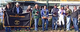 The winning connections of Relentless American accept the $42,030 $358,864 Black Gold Futurity Championship [RG3] trophy at Will Rogers Downs on Tuesday.