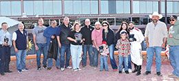 The winning connections of Bad Kin accept the Pepsi Cola Stakes trophy at Sunland Park on Saturday.