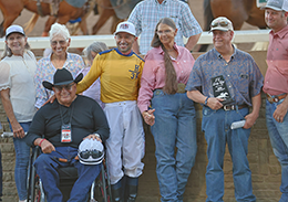 The winning connections of Flying Fire accept the FL Lady Bug Stakes trophy on Saturday at Remington Park.