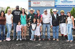 The winning connections of Ud Cholula accept the Isawsugarbeaer Fillies & Mares Stakes trophy on Sunday.