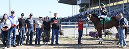 The winning connections of Cayenneoverthemoon accept the Wyoming Bred Classic Stakes trophy at Energy Downs on Friday.