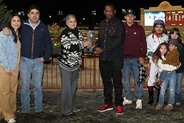 The winning connections of Joose Boxx accept the $30,000 Turkey Time Stakes trophy at Lone Star Park on Friday.
