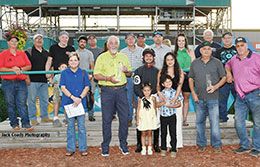 The winning connections of Collective Power accept the Speedhorse Paint & Appaloosa Futurity stakes trophy at Fair Meadows.