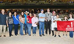 The winning connections of CJR Rooster accept the Benny Pennington Memorial Stakes trophy on Friday at Retama Park.