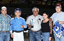 The winning connections of Jess Star Struck accept the Sam Houston 250 Stakes trophy.
