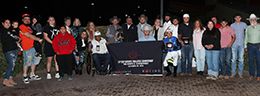 The winning connections of Volcoms Favorite accept the $118,975 Lip Chip LLC Distance Challenge Championship [G1] trophy at The Downs At Albuquerque on Saturday.