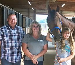 Glen, Sheri and Katie Miller with Escondido Beach earlier this year.