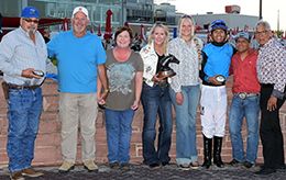 The winning connections of One Fabulous Dynasty accept the $ $42,262 Prairie Meadows Derby Challenge trophy Friday.