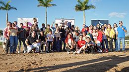 Fans, family members, and the team gather for Blacktag’s victory photo.