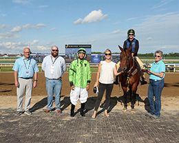 The winning connections of TW Streakin Cowboy accept the $112,920 QHRAI Derby trophy at Horseshoe Indianapolis on Thursday.