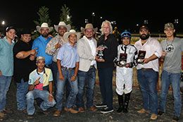 The winning connections of Kiss My Maruska accept the Dash For Cash Futurity stakes trophy at Lone Star Park Saturday.