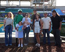 The winning connections of Wire Tap accept the Ray Graves Memorial Stakes trophy at Fair Meadows in Tulsa on Saturday.