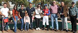 The winning connections of Jess Mr Mayito accept the $69,108 AQRA Turf Paradise Open Quarter Horse Futurity trophy at Turf Paradise on Monday.