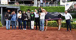 The winning connections of Phillybuster accept the AMCCCCM Classic trophy at the Hipodromo de las Americas on Sunday.