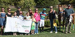 The connections of Pretty Runaway accept the Ontario Sires Stakes Maturity winning trophy at Ajax Downs on Sunday.