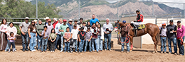 The winning connections of Flashing Light accept the Golden Spike Derby stakes trophy at Weber Downs Saturday.