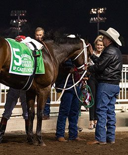 Trainer Monty Arrossa with Bp Cartel Policy following his victory in the Los Alamitos Super Derby.