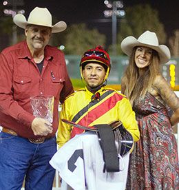 Scott Willoughby, Gabriel Lara, and Tracie Kling accept the Be A Bono Stakes trophy.