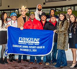 The winning connections of Kempton accept the EVD Futurity stakes trophy.