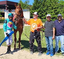 Shakoo Makoo with trainer Anthony Alderson (second from right with brother Glen), jockey Tony Phillips and assistant Sean Slater.
