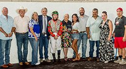 The winning connections of Ttt La Kas accept the Nag Nest Stakes trophy.