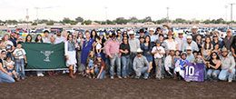 The winning connections of Karmalites accept the All American QH Oaks stakes trophy at The Downs at Albuquerque.