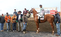 The winning connections of O Donovan Rossa accept the trophy after winning the $36,35,516 Q-Racing Video Distance Challenge Stakes on Sunday at Remington Park.