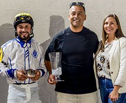 Owner Jaime Cardenas and jockey Javier Gracia accept the Lassie Futurity stakes trophy at Delta Downs.