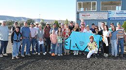 The winning connections of Ajs Favorite Ia accept the Polk County Derby stakes trophy on Saturday.