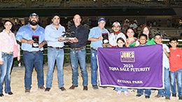 The winning connections of Joose Box accept the TQHA Sale Futurity stakes trophy.