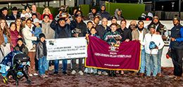 The winning connections of San Lorenzo Chrome accept the LQHBA Louisiana Million Futurity stakes trophy.