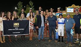 The winning connections of Embers Time accept the Dash For Cash Juvenile Stakes trophy at Lone Star Park.