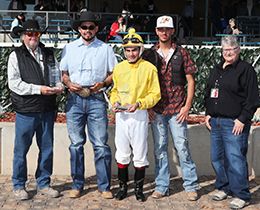 The winning connections of La Nanas accept the $100,000 James Isaac Hobbs Stakes trophy at Zia Park on Sunday.