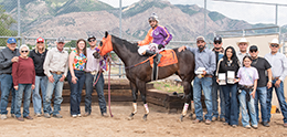 The winning connections of Mysterious Hero accept the Beehive Futurity stakes trophy at Weber Downs Saturday.