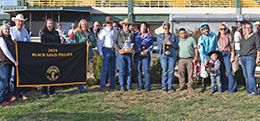 The winning connections of Catchn Southern Rays accept the Black Gold Fillies Futurity Championship stakes trophy at Will Rogers Downs.