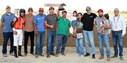 The winning connections of Arbitro accept the $46,376 John Deere Juvenile Challenge trophy at Horseshoe Indianapolis on Thursday.