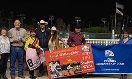 John and Kathie Bobenrieth present the stakes trophy to Scott Willoughby and the winning connections of Defending Champ.