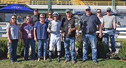 The winning connections of Vesper Martini accept the $74,500 Pot O Gold Futurity [G1] trophy at Will Rogers Downs on Monday.