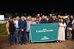 The winning connections of Doodah Cartel accept the $185,100 El Primero Del Año Derby (G2) trophy at Los Alamitos on Sunday.