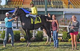 The winning connections of Storms Livewire accept the Green Country Stakes trophy at Will Rogers Downs.