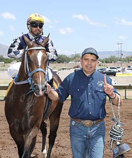 Ariatt returns to the winner's circle after winning his trial heat to the All American Futurity on Friday.