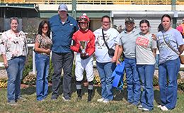 The winning connections of Queen For Cash accept the $15,800 Sequoyah Stakes trophy at Will Rogers Downs on Sunday.