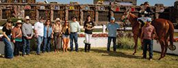 The winning connections of Straight And True in the Freson Dash winner's cricle.
