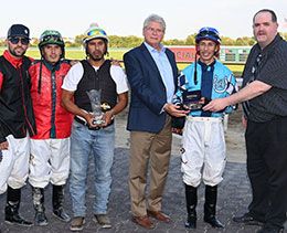 Angel O. Ramirez jockey award photo – Derron Heldt, VP for Racing, and Chad Keller, QH Racing Secretary, presenting to Angel.